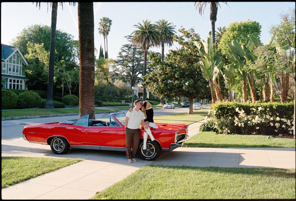 film engagement photos with vintage car