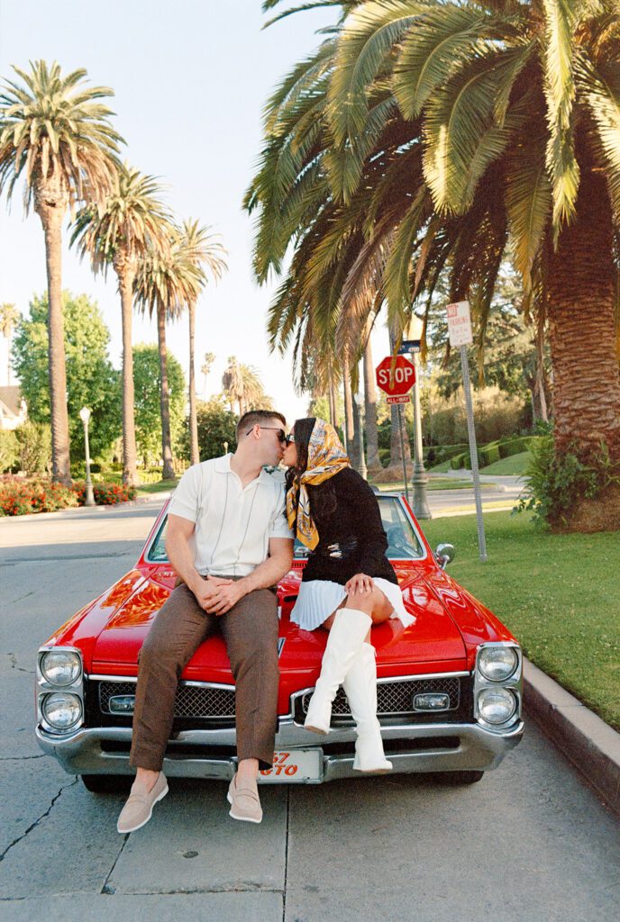 film engagement photos with vintage car