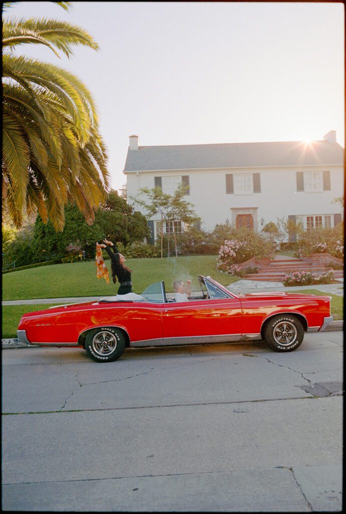 film engagement photos with vintage car