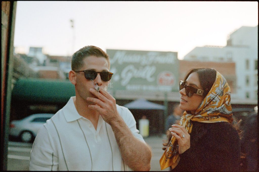 Couple having a smoke outside of Musso & Frank Grill in Hollywood